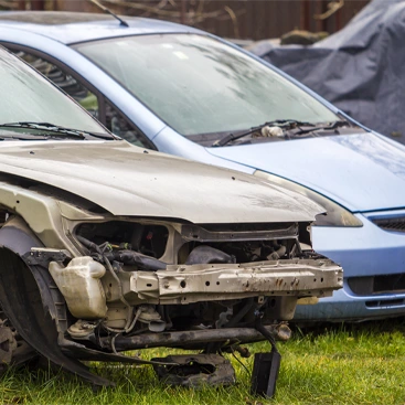Severely damaged car with missing front parts ready to be sold for cash. We buy junk cars in any condition, offering fast cash offers, free towing, and a simple process to help you sell your junk car without stress.